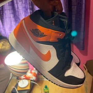 Orange, black and white Jordan 1s